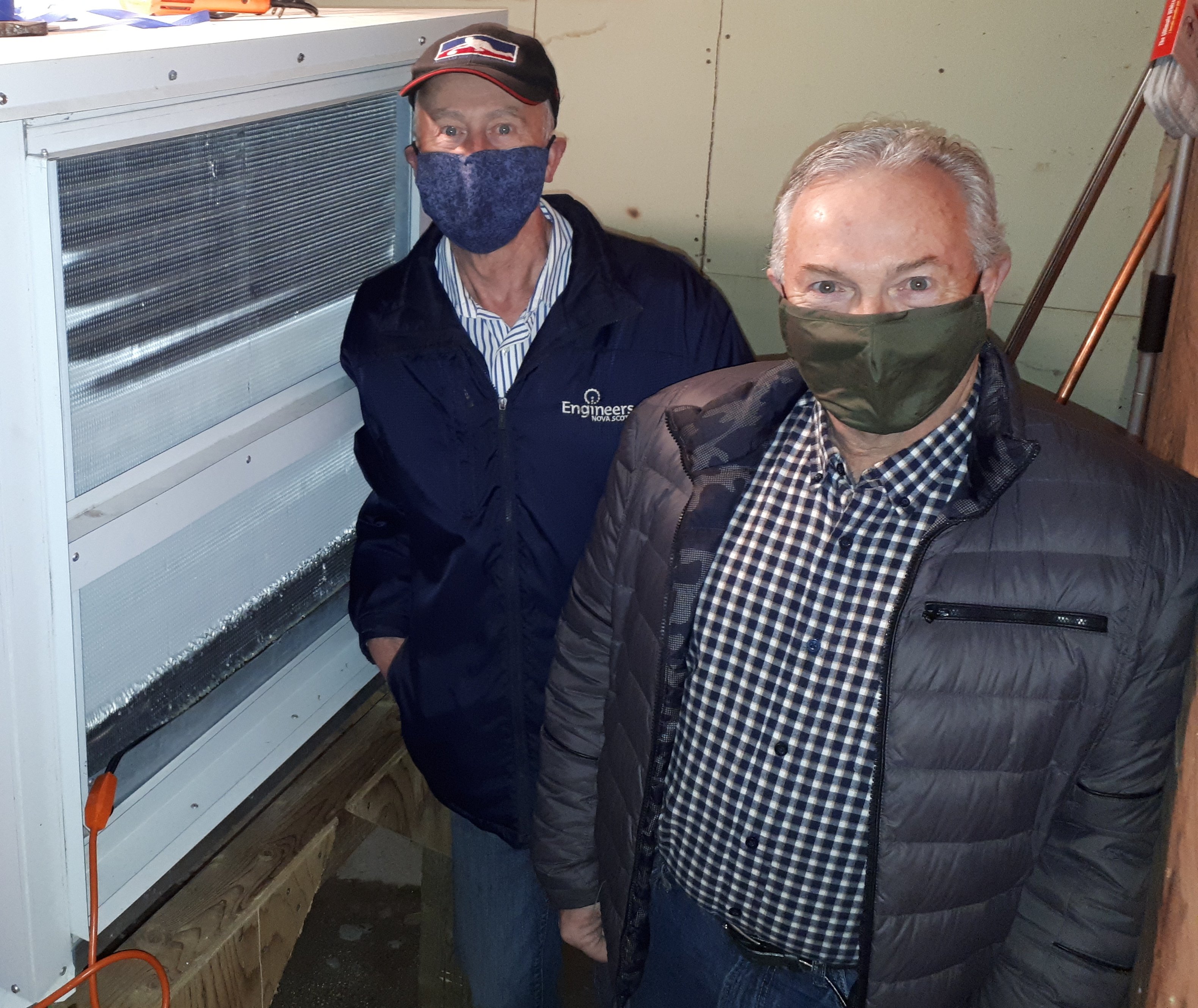 Harry Daemen and Owen McCarron with the repaired dehumidifier