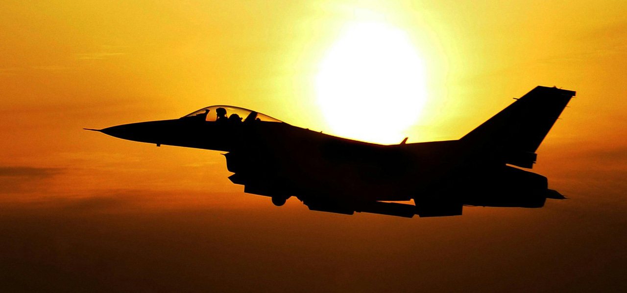 A jet with the sunset behind it