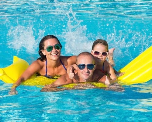 Family In Swimming Pool