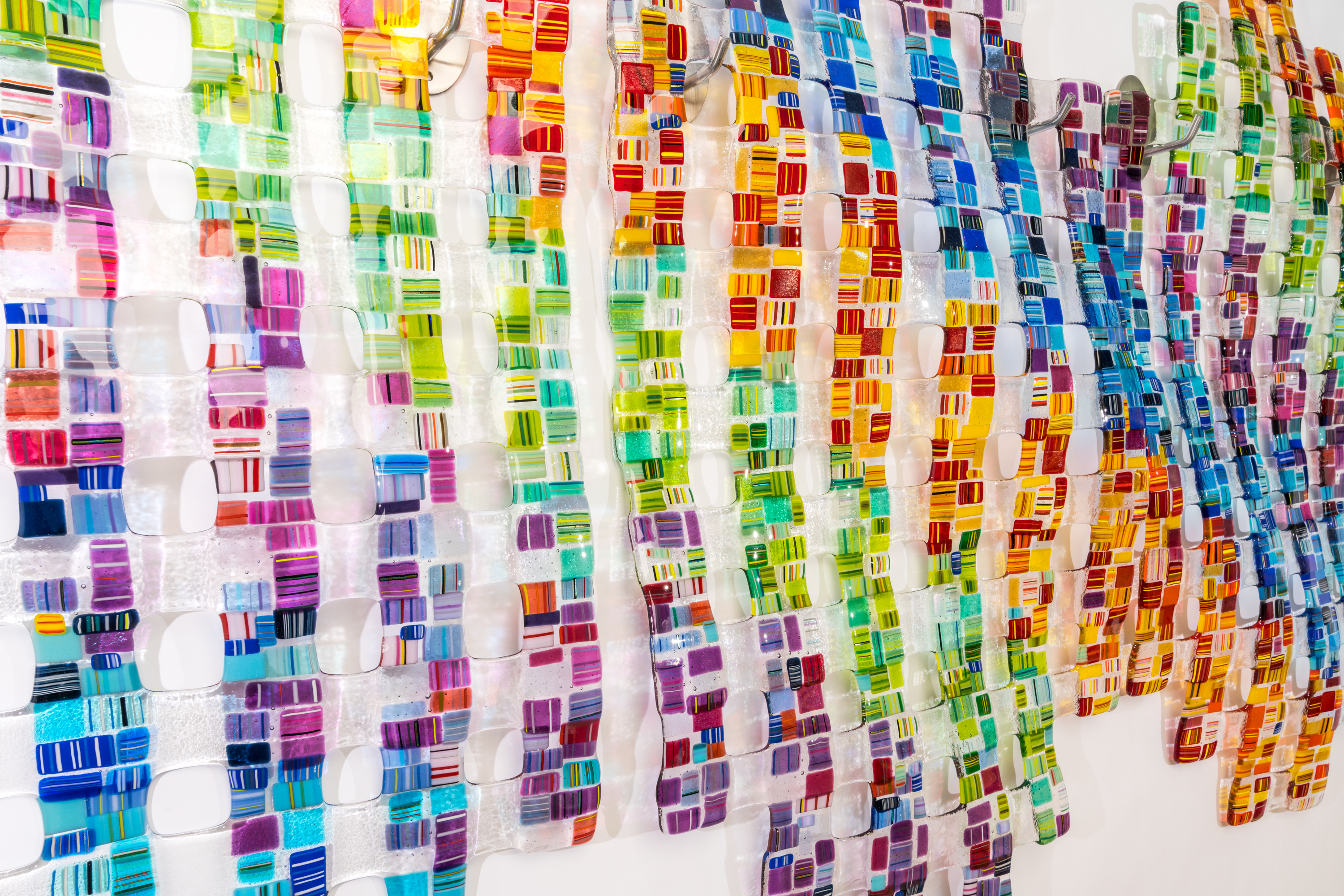 Modern living room with large windows, indoor plants, a cozy gray sofa, round coffee table, kitchen area with wooden cabinets, and a large framed tree artwork on the wall.
Modern living room with large windows, indoor plants, a cozy gray sofa, round coffee table, kitchen area with wooden cabinets, and a large framed tree artwork on the wall.