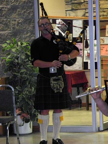 Band member playing the bagpipes 2017