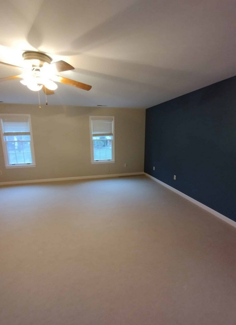 Spacious Room with Fresh Blue Accent Wall