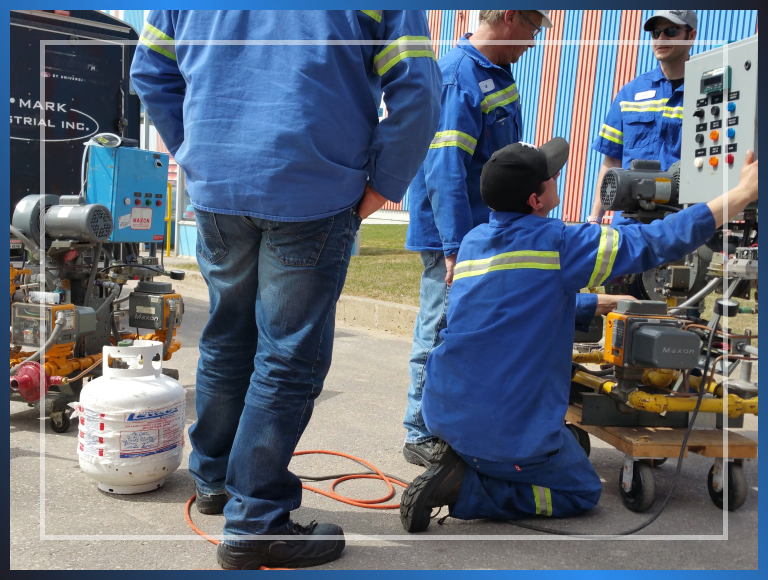 Several men wearing matching blue work shirts