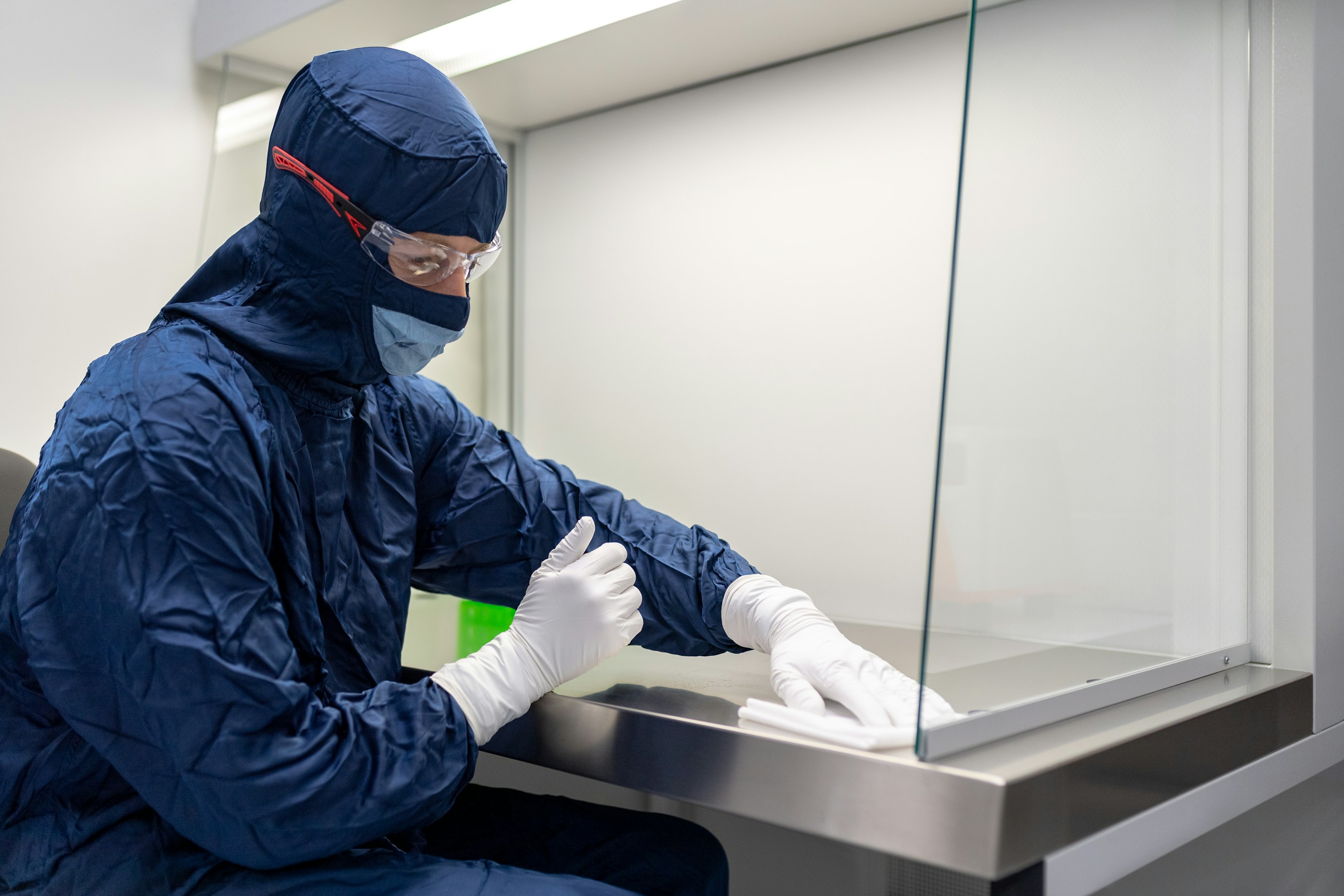 a person wearing a mask and gloves