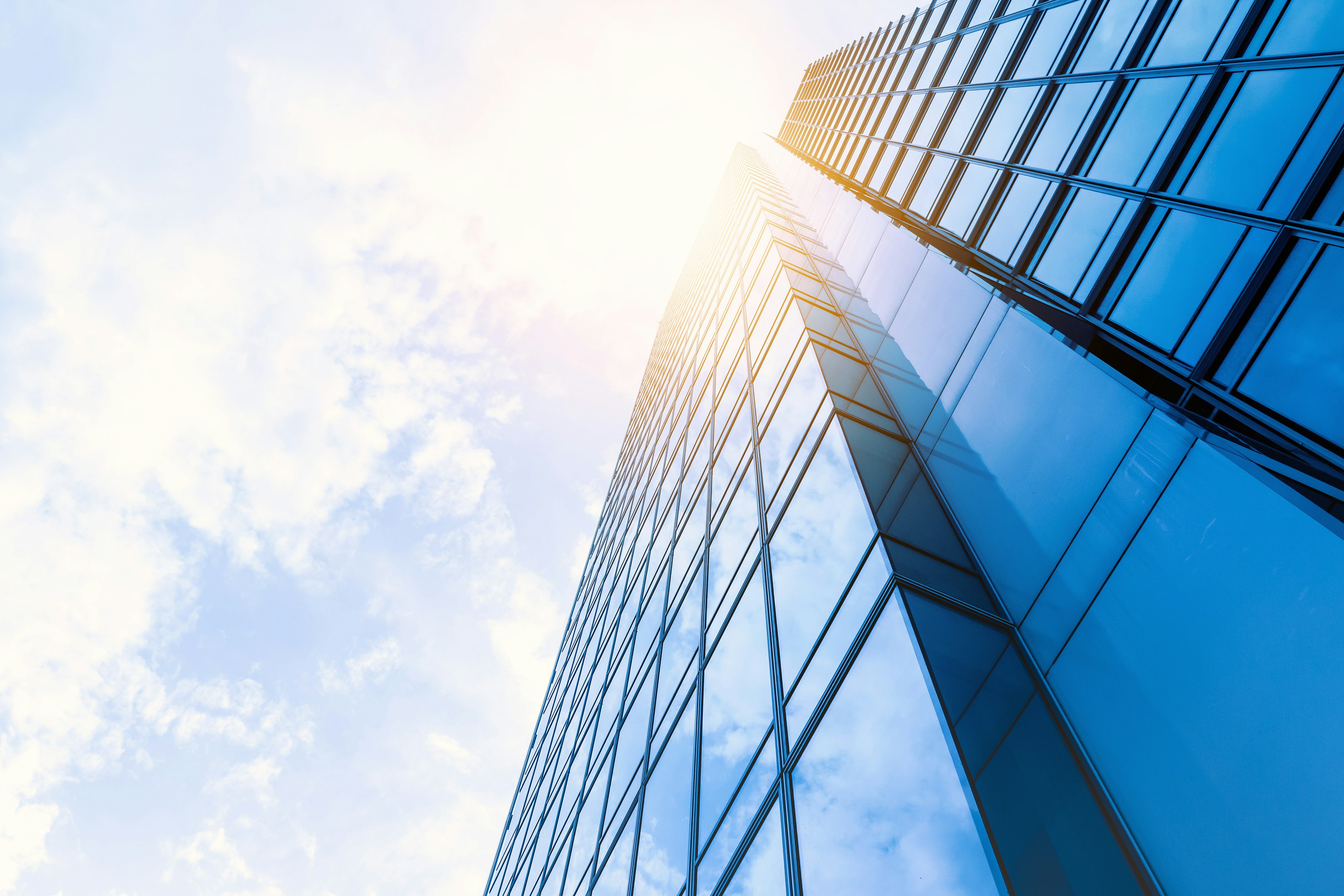 low-angle photo of curtain wall building