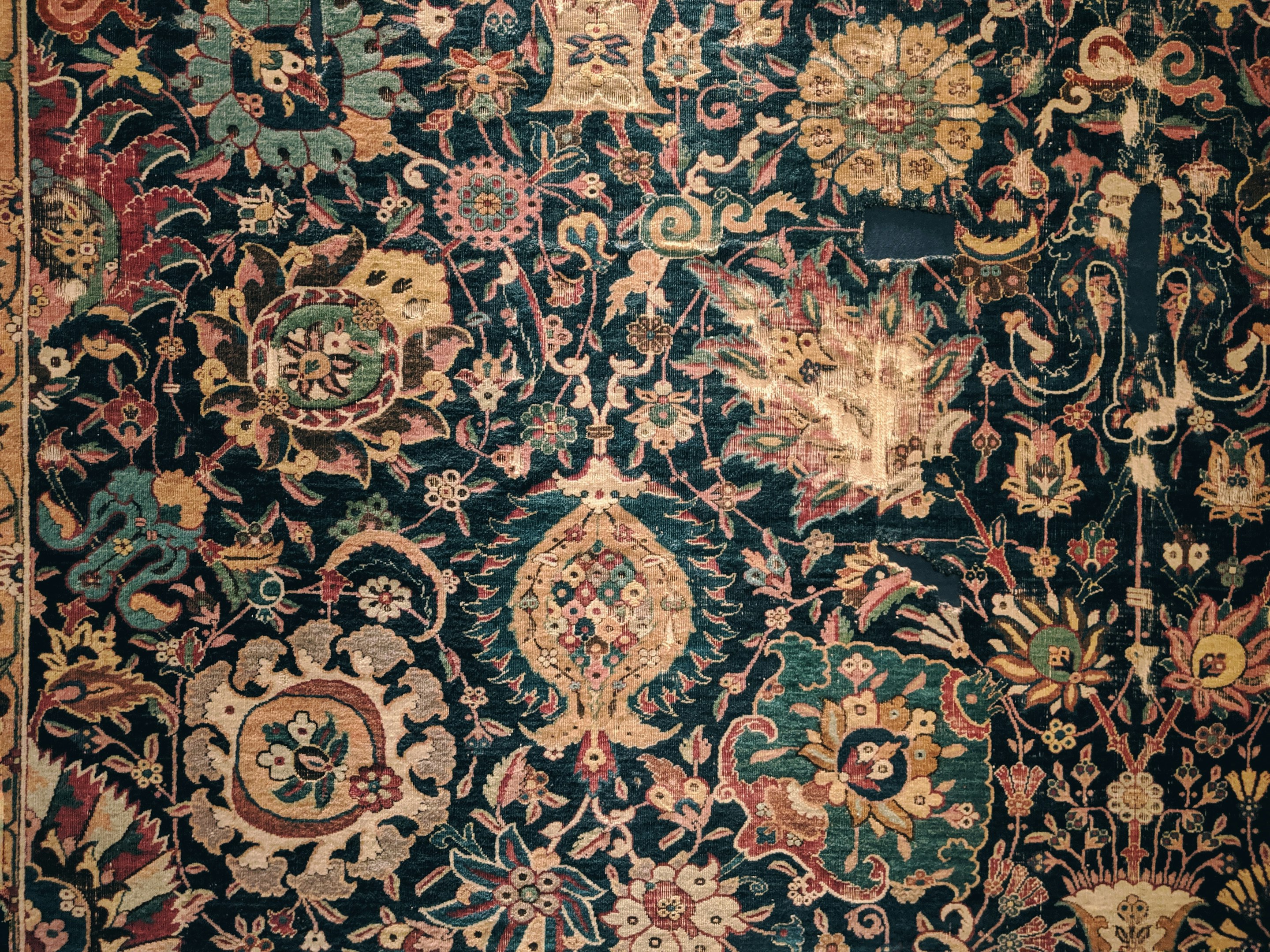 a large rug with many different colors and designs a large rug with many different colors and designs