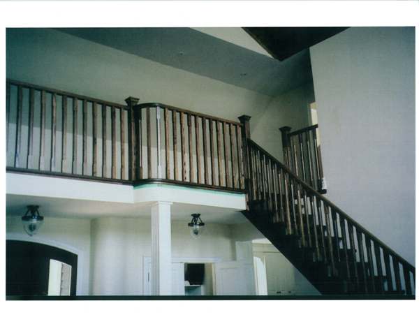 Straight red oak Scandinavian style stair with open stringers