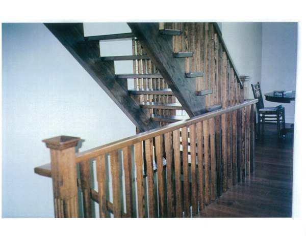 Straight red oak Scandinavian style stair with open stringers