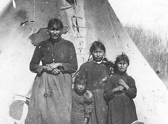 Does anyone recognize this mother and Children? Our information is very minimal and only indicates that they come from the Peace River area - and we're not sure if that means the actual river or the town of Peace River.
2015.27.40 / Nugent, Mike.