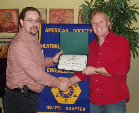 Chapter President Kevin Clannon (L) presents Ken Martin with an ASHRAE Service Award at the January Chapter Meeting