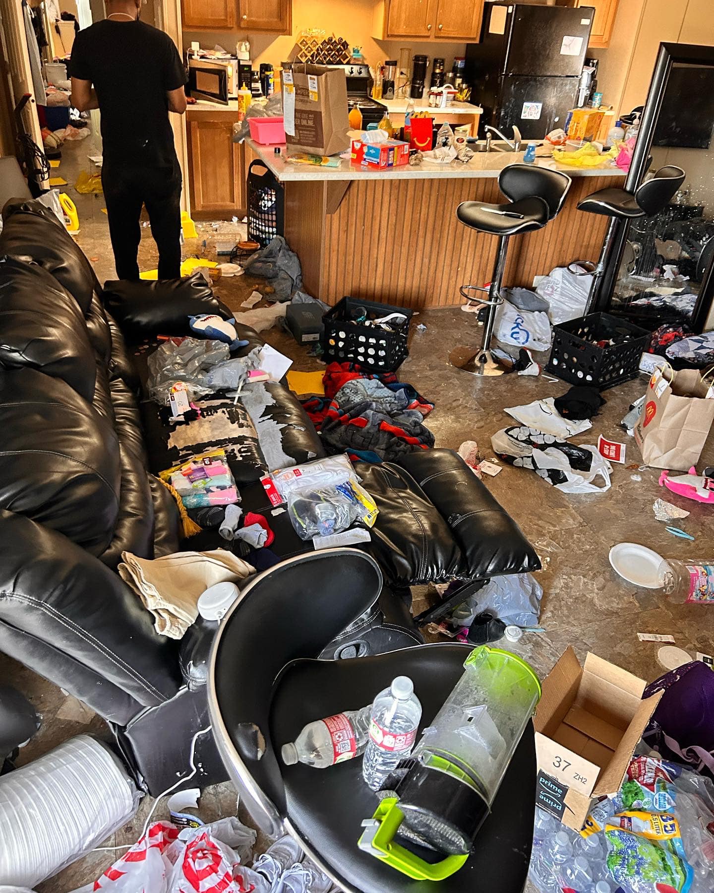 Cluttered Kitchen and Living Room Before Deep Cleaning