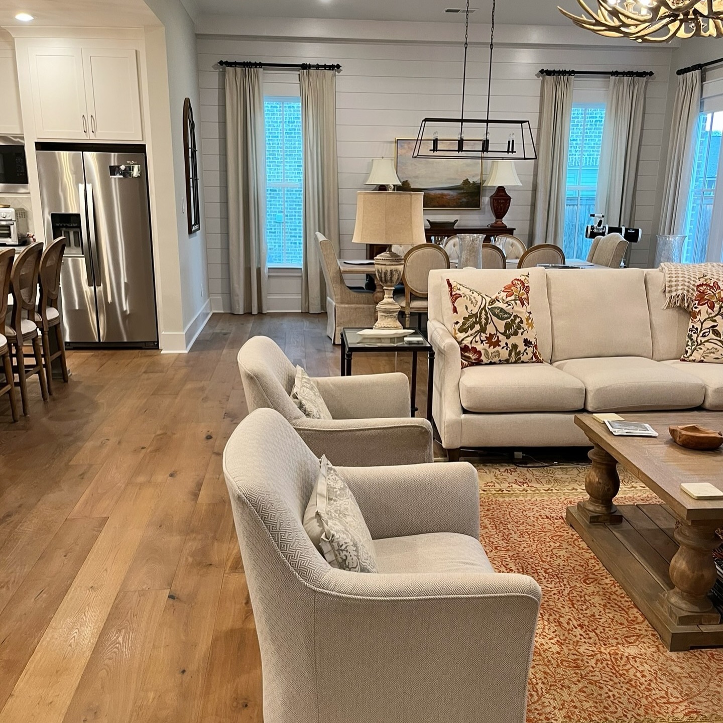 Open concept living and dining area maintained through ongoing home care with clean surfaces and organized presentation
