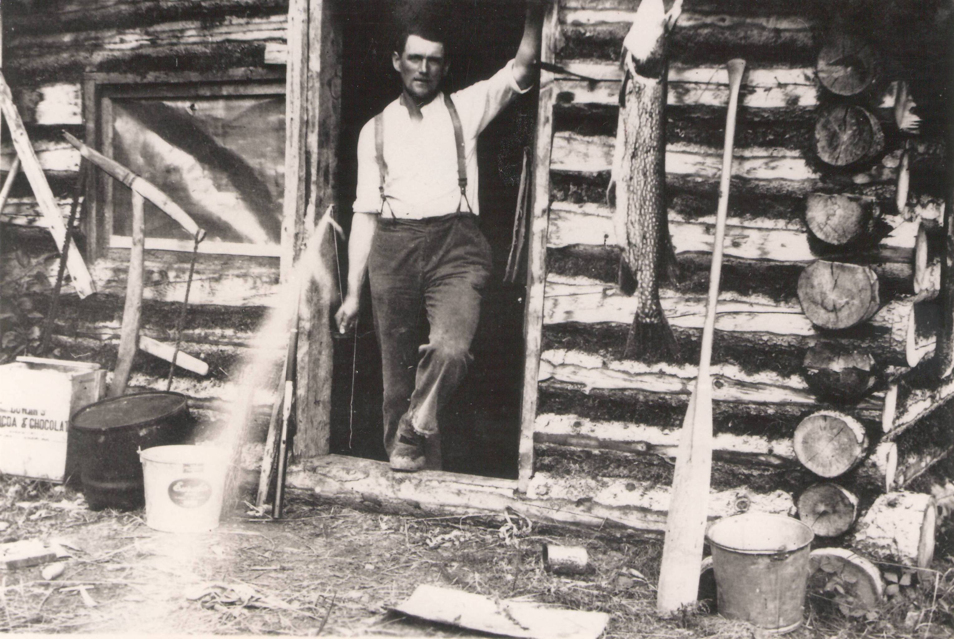 This picture belongs to the Karl Hassel collection and is labelled "Dad at the cabin with jack fish..." That leads us to speculate that this would be Karls father - but we don't know his name! Also of note is the large jackfish, and if you look close you can see he is holding a string that looks like a white streak through the frame. Whoever this is - was clever in rigging up a system to take a photo of himself!
Hassel, Karl / 990.4.42.31