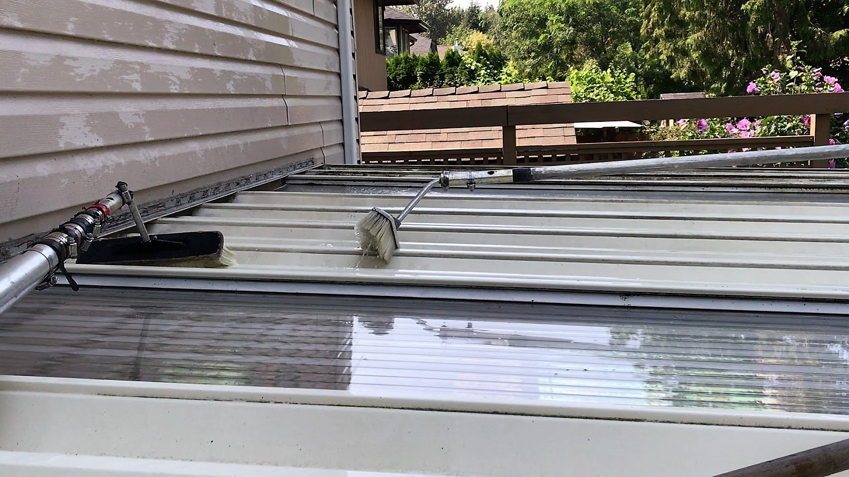 brush washing top of glass deck cover