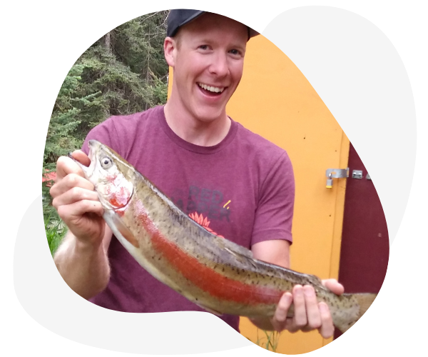 Man in Maroon T-Shirt With His Catch