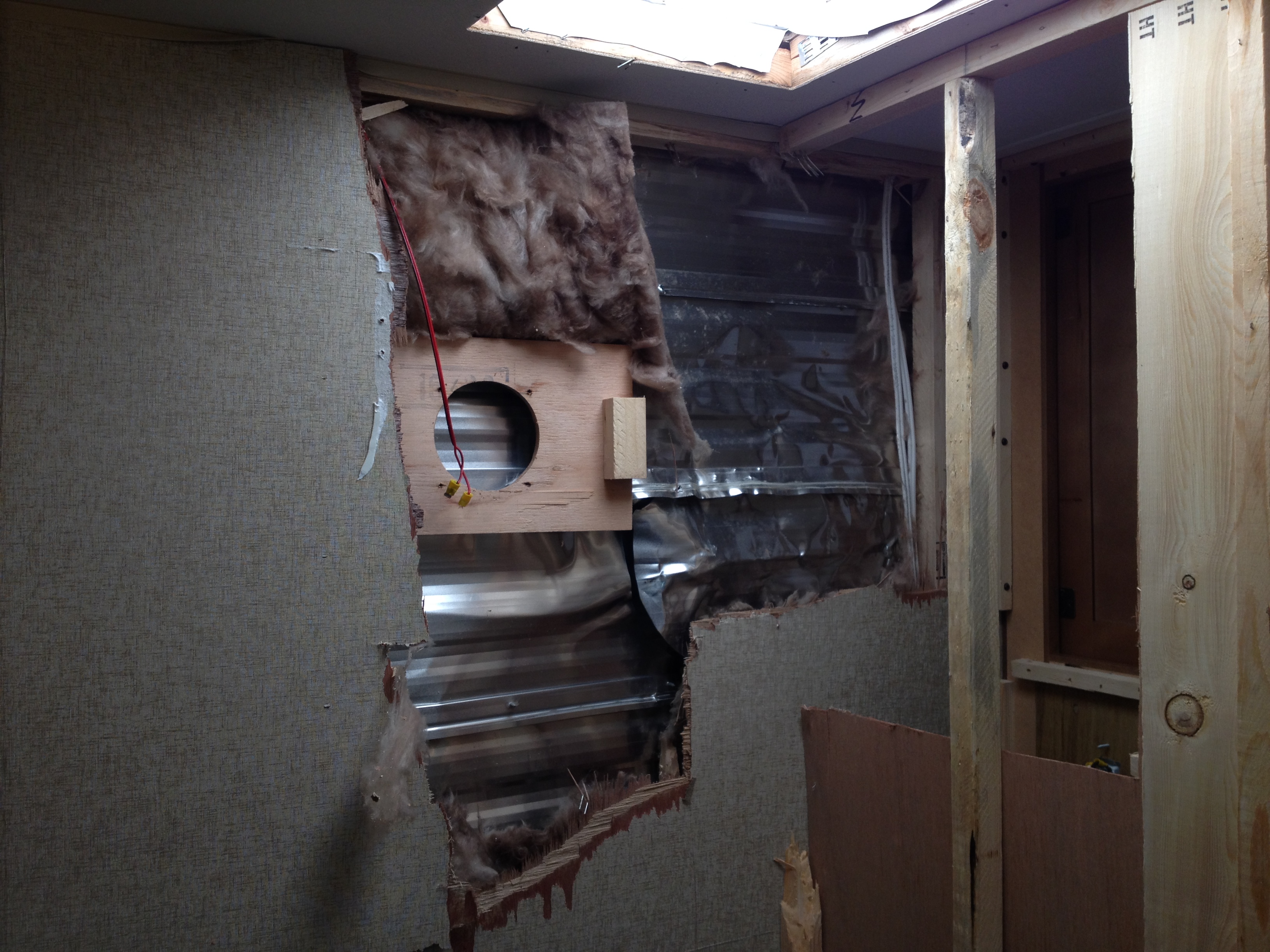 Right behind the shower and the closet