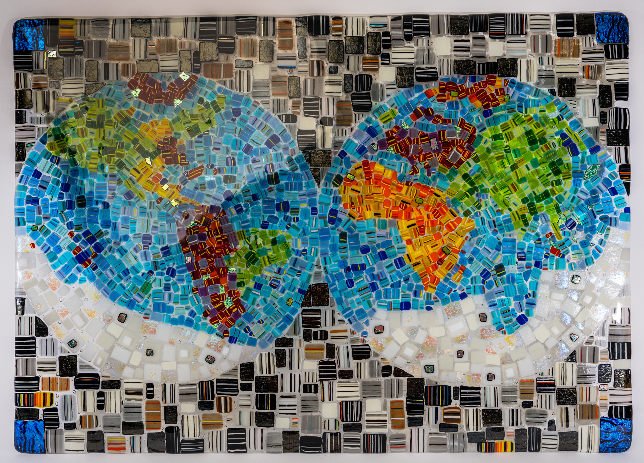 Modern living room with decorative glass vases, green plants, and a floor lamp, showcasing a bright and airy interior design.
