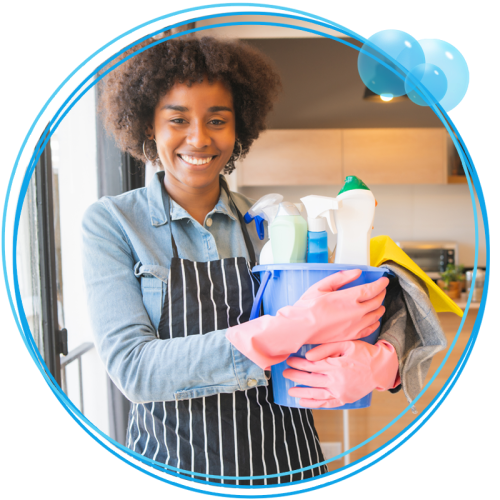 Woman holding a bucket of cleaning supplies in a home.
