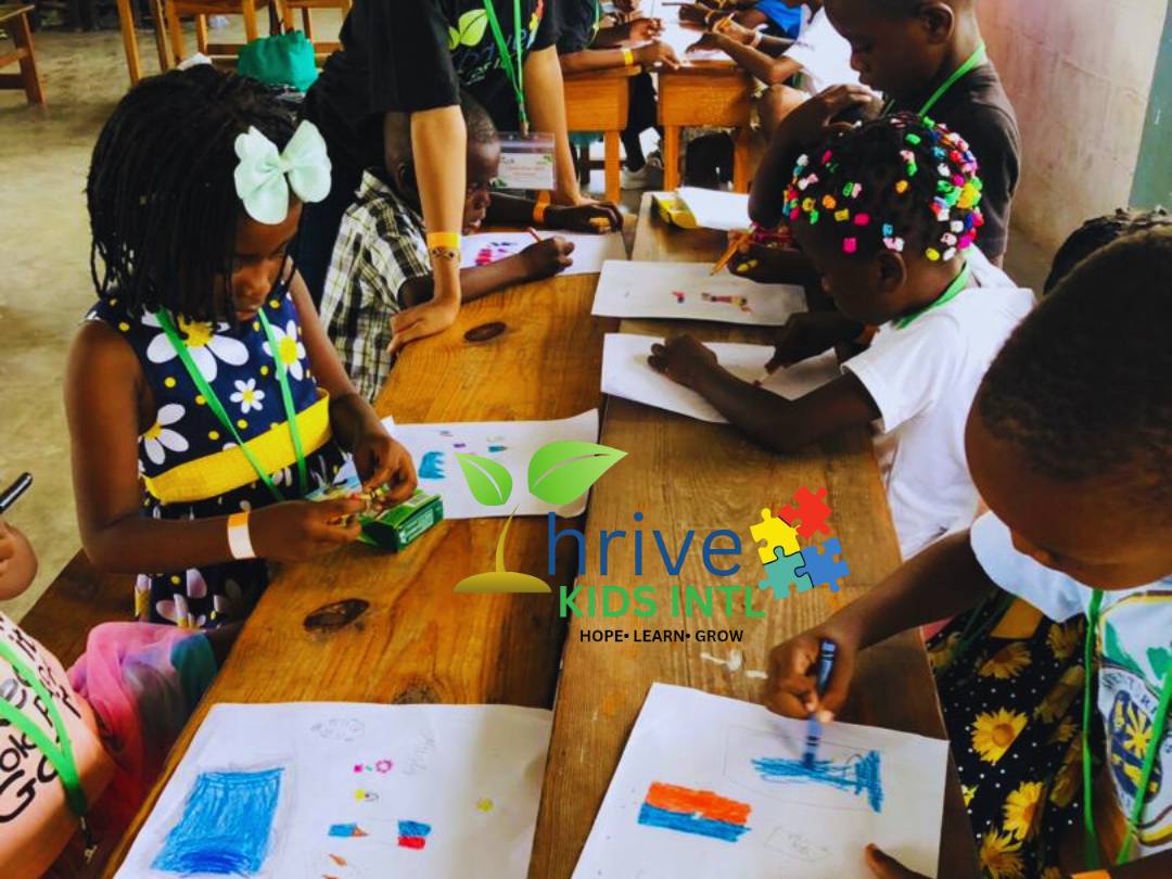 Three children engaging in an educational activity, focusing intently on a paper, in a classroom setting.