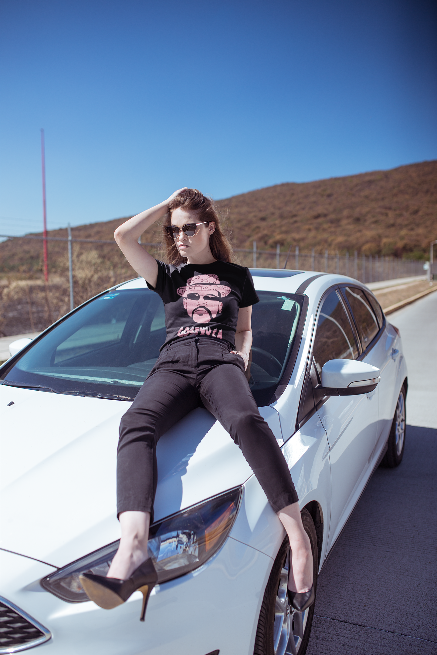https://0901.nccdn.net/4_2/000/000/046/6ea/-a-stylish-woman-wearing-a-tee-and-heels-posing-on-a-car-gosexyc.png