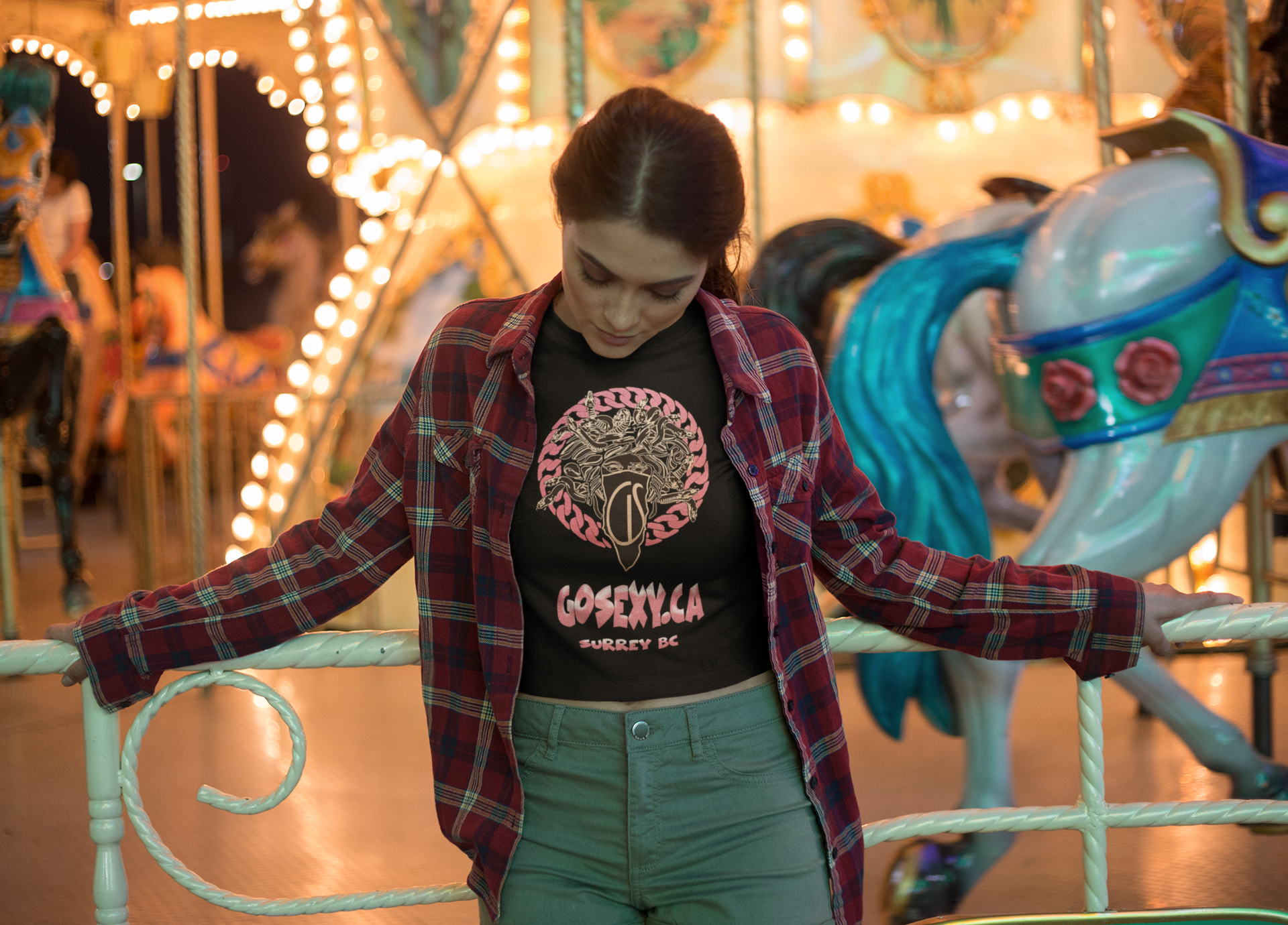 https://0901.nccdn.net/4_2/000/000/046/6ea/bored-girl-wearing-a-crop-top-tee-against-a-carousel-gosexyca.png