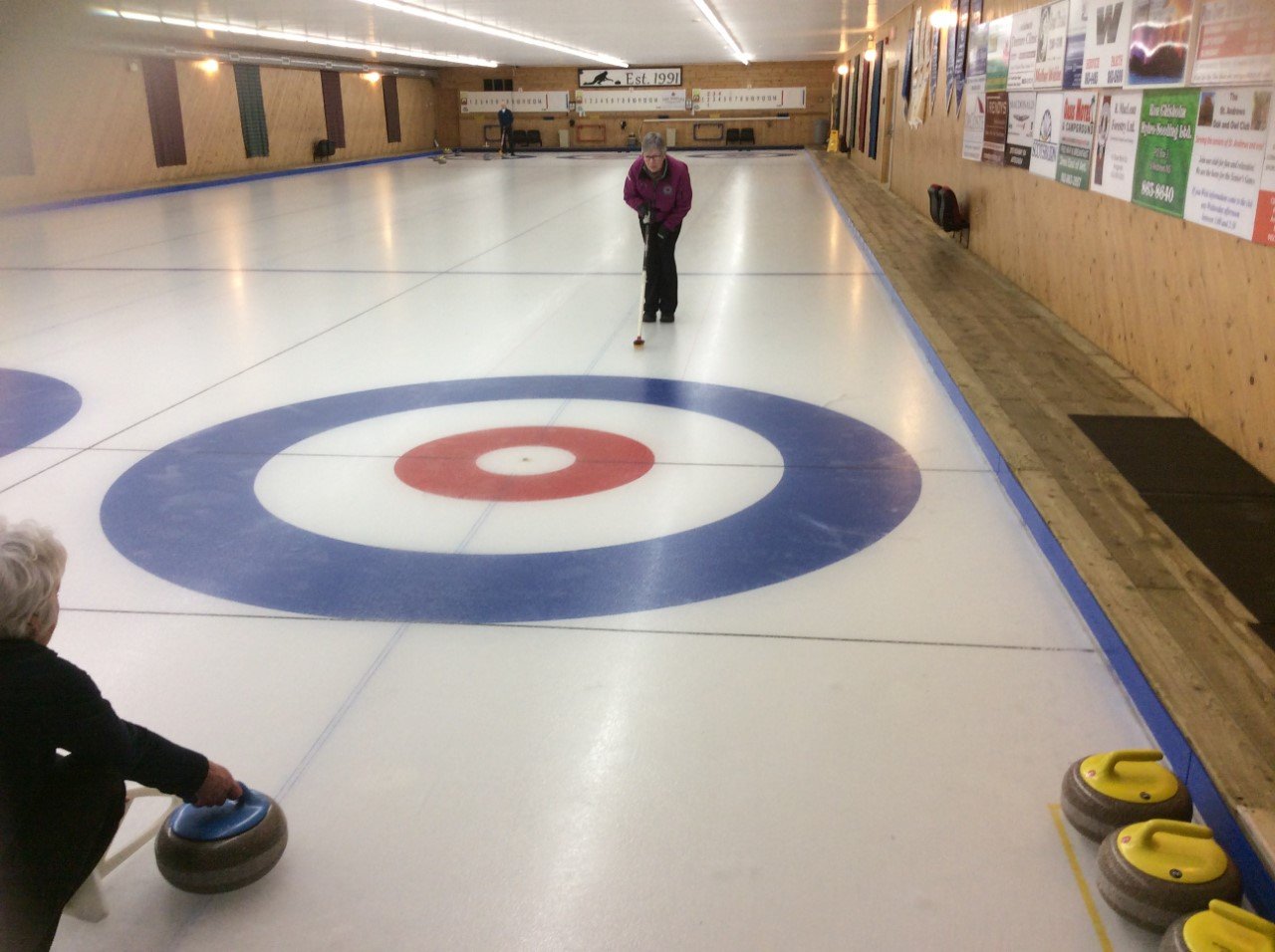 Linda Juurlink instructing at Highlander Curling Club
