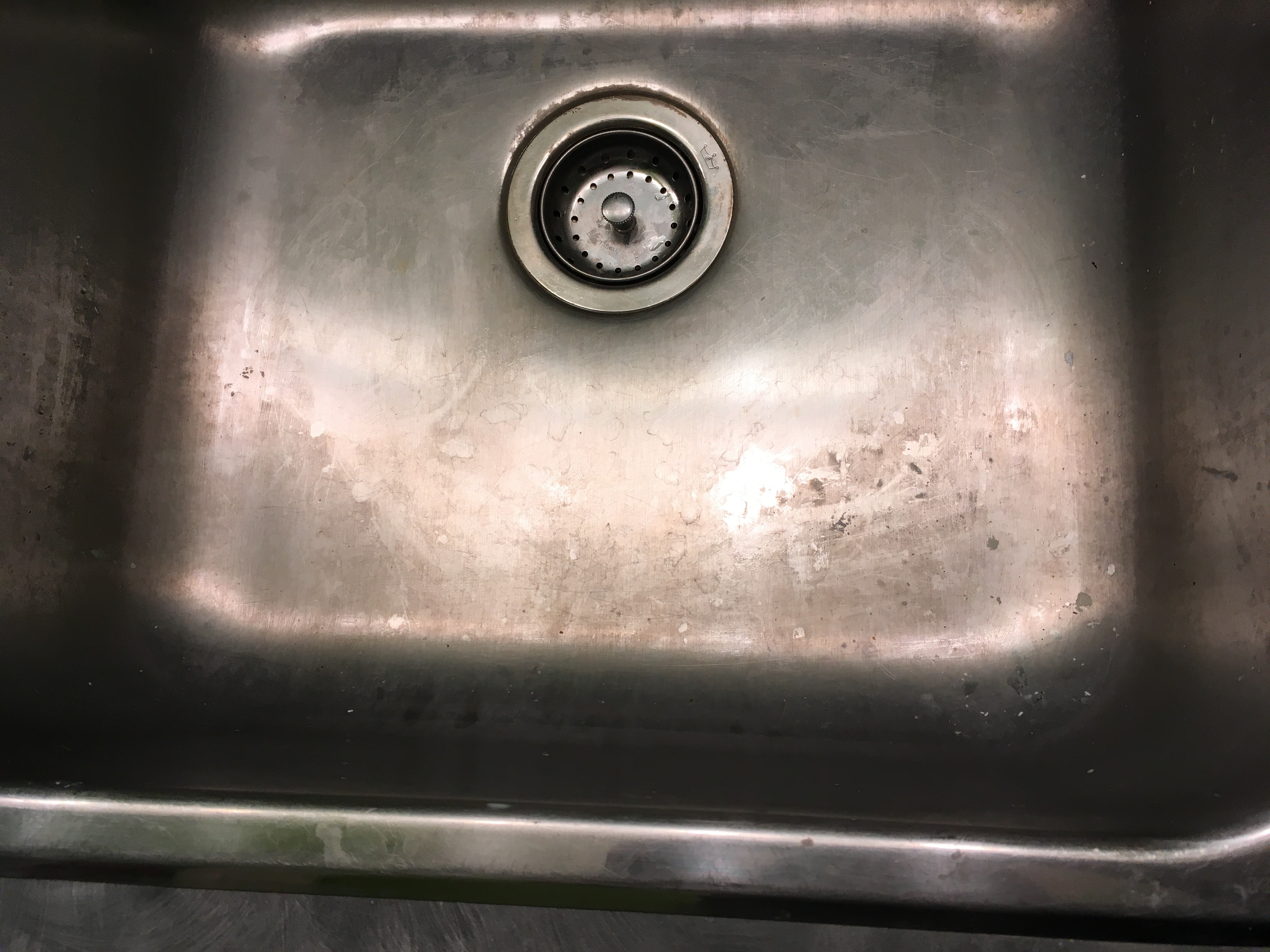 Stainless Steel sink with household cleaners