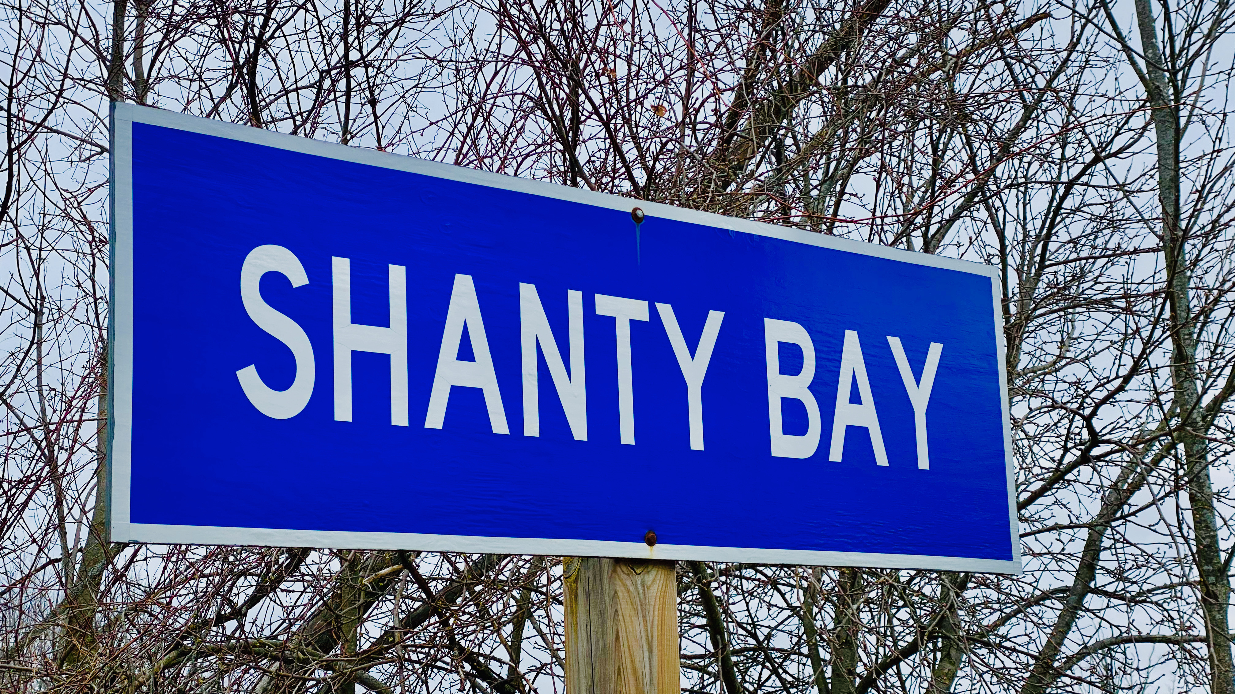 https://0901.nccdn.net/4_2/000/000/046/6ea/the-bay-photos-shanty-bay-sign---1.jpeg