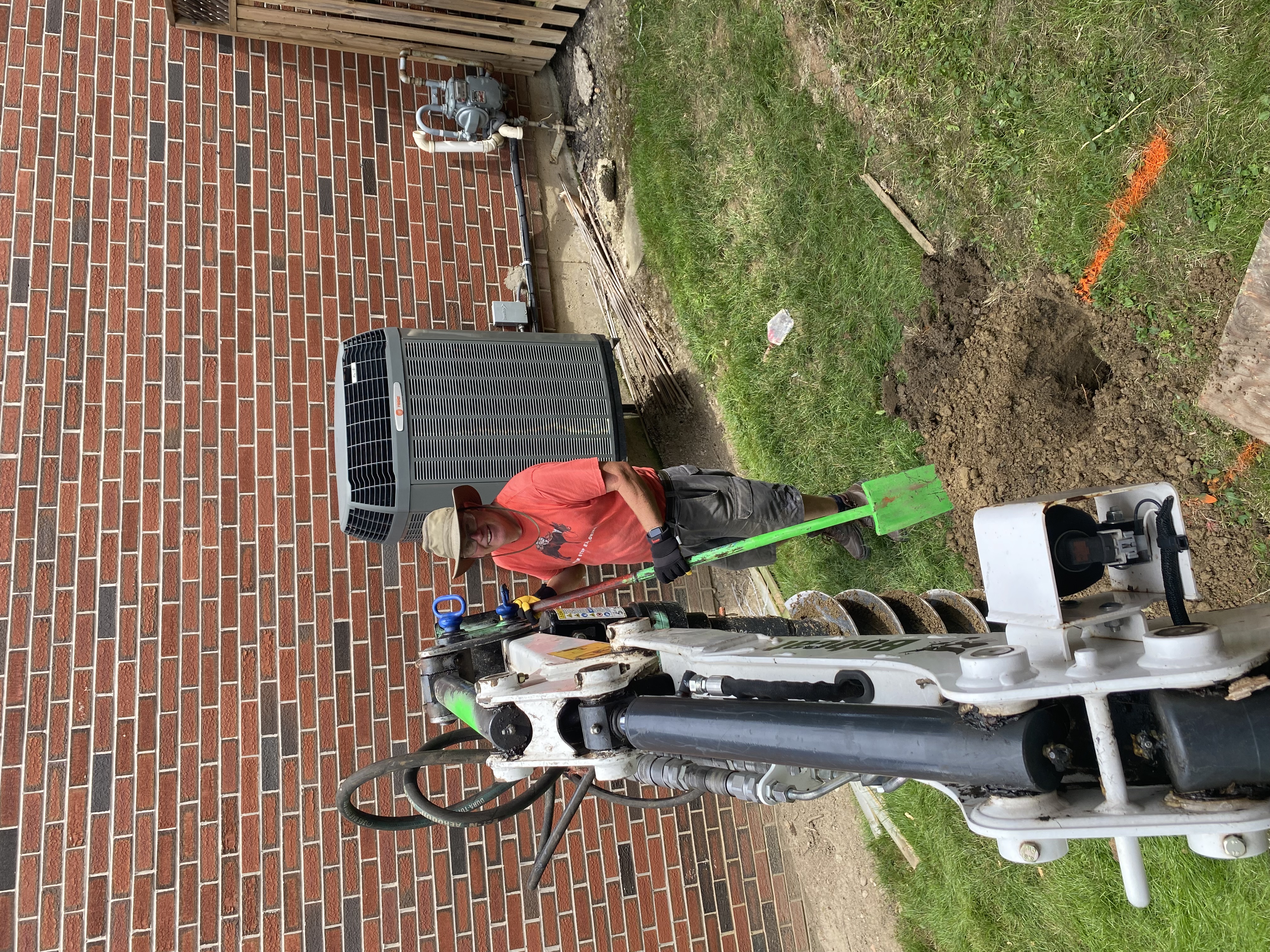 A very hot day to dig out fence posts.