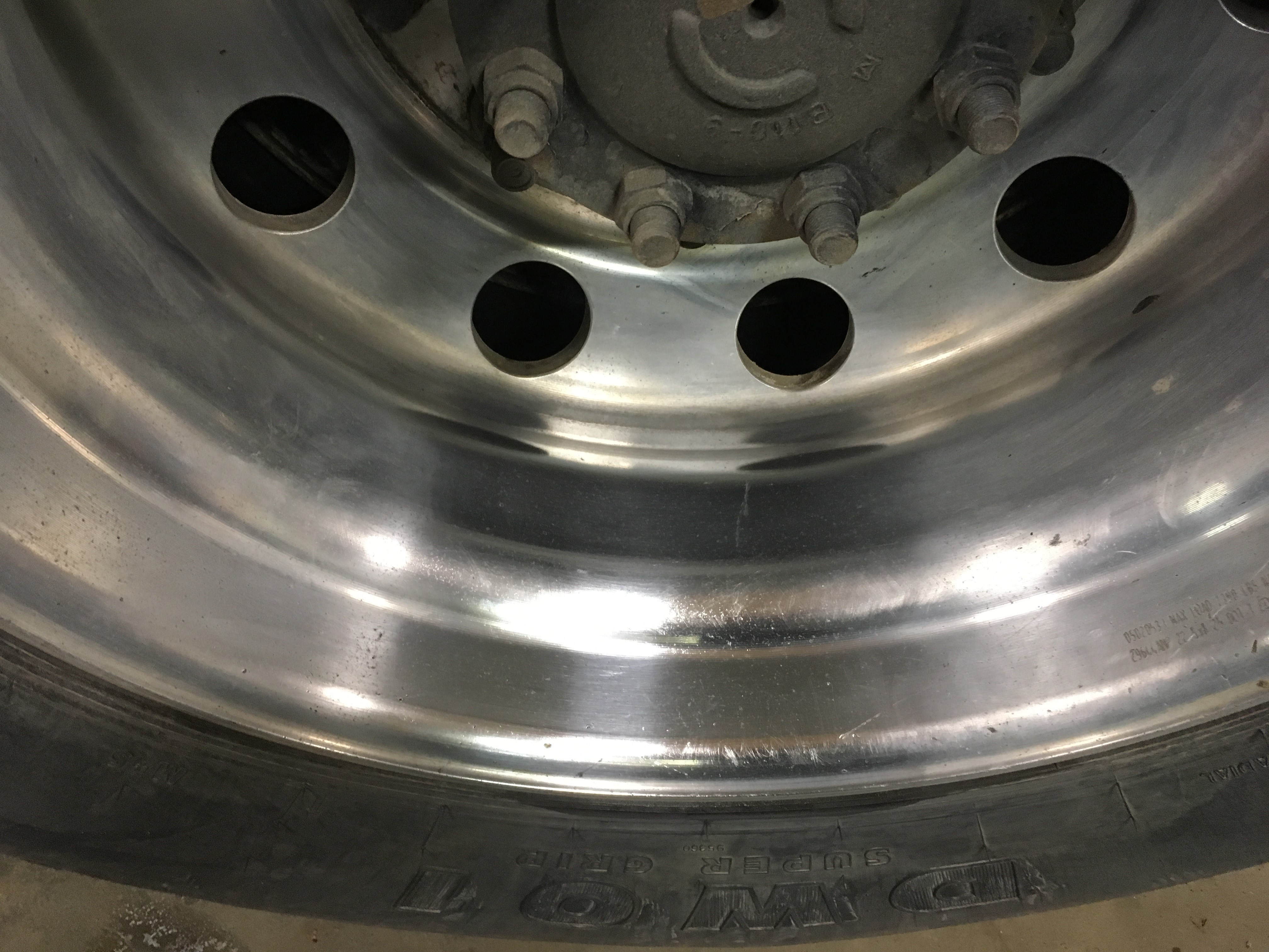 Alcoa Wheel after using White Diamond Metal Polish in small area at bottom