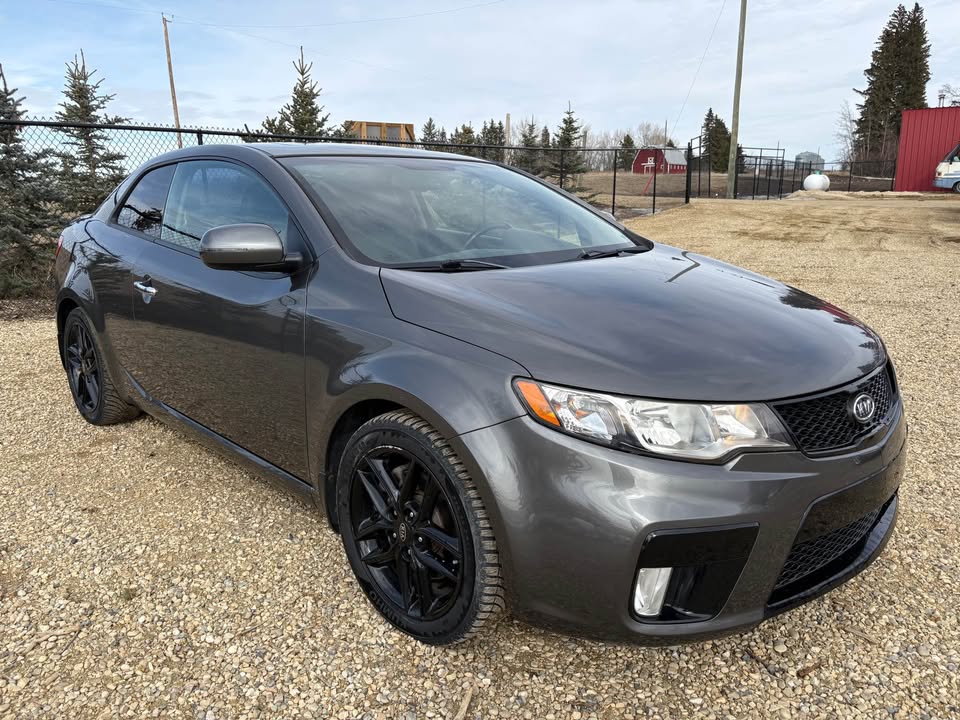 blue sedan on snow ground