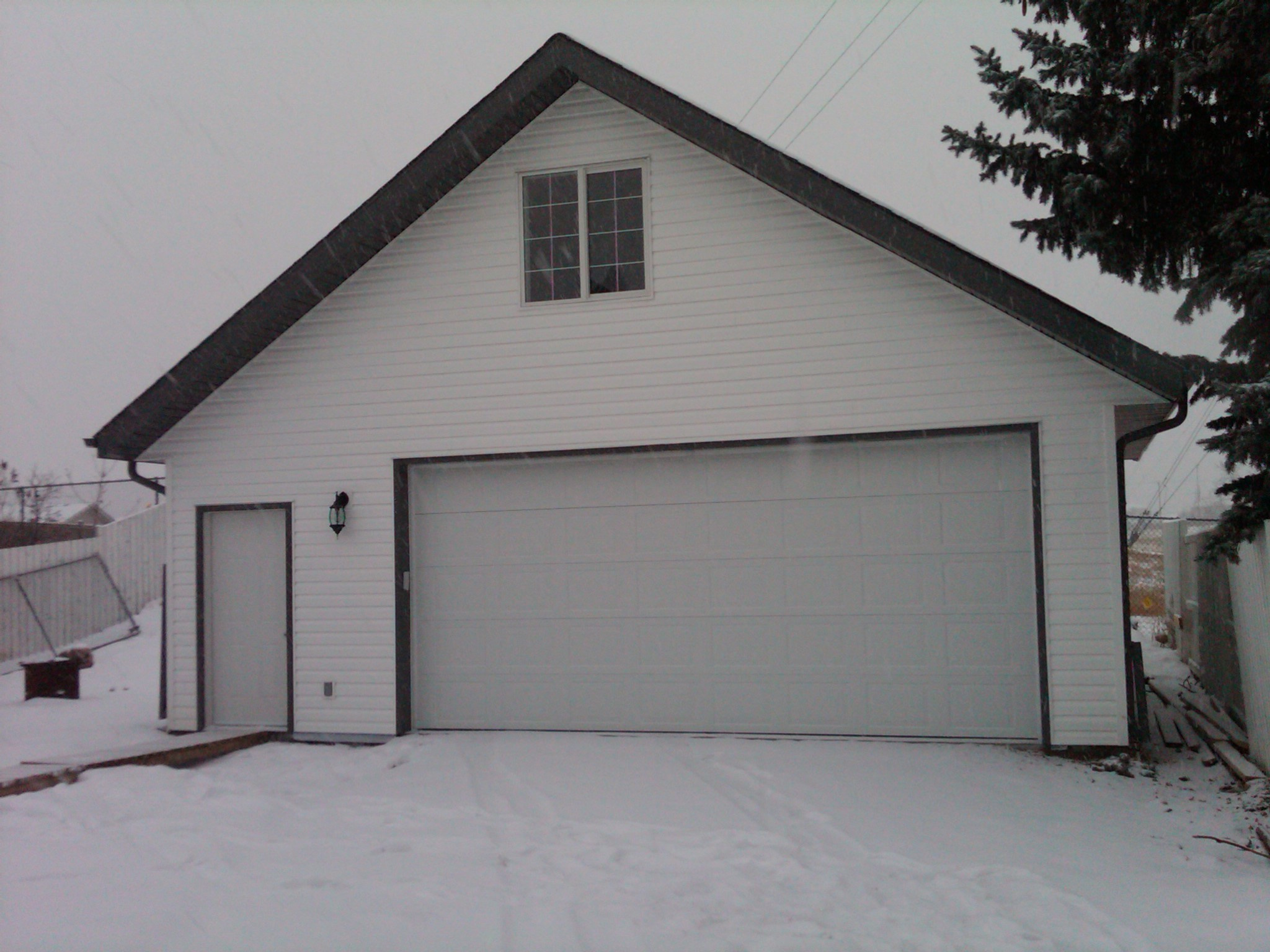 Detached garage with storage attic above
