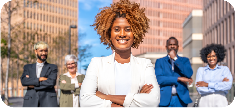 People smiling at the camera with their arms folded People smiling at the camera with their arms folded