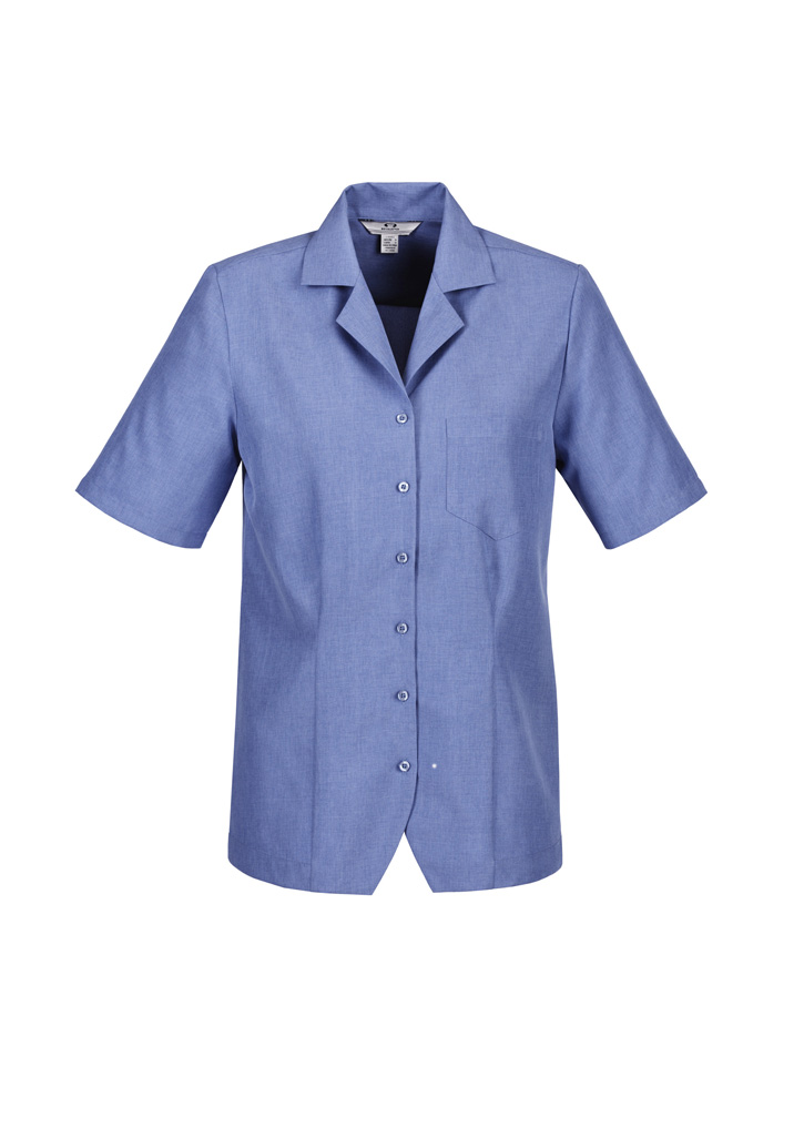 a blurry photo of a fence and a tree