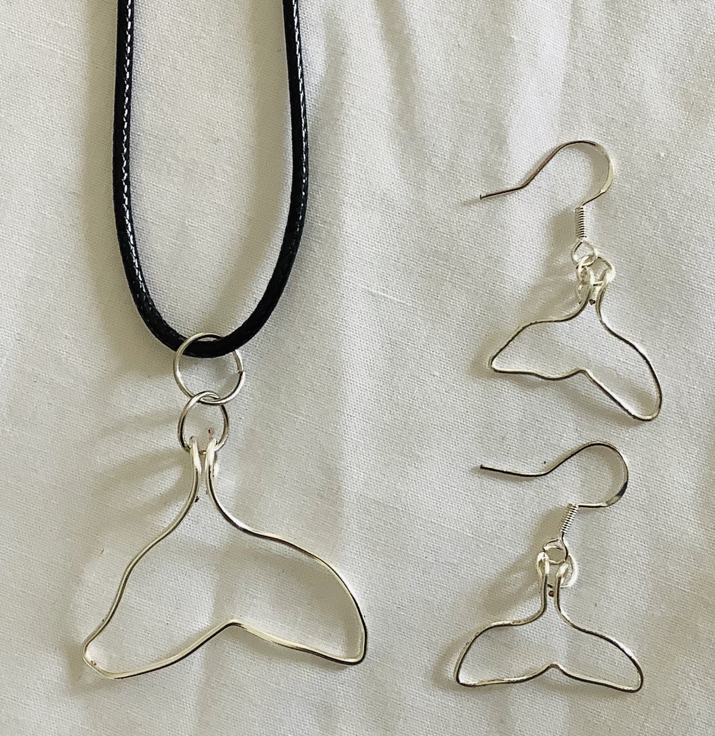 Whale Pendants and Earrings. Handcrafted individually using silver colored wire or aluminum wire. $40.00 a set or can be purchased separately.