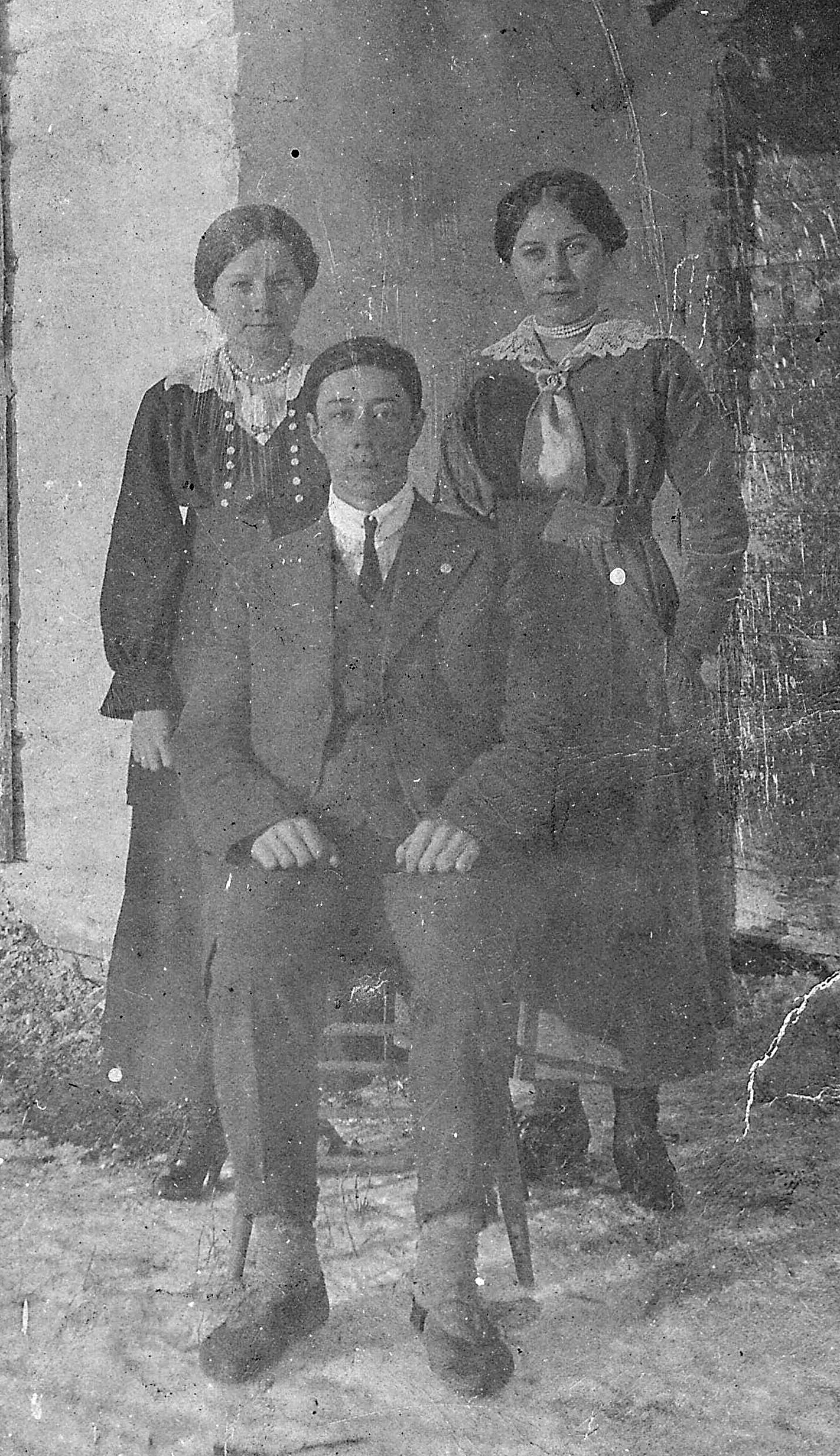 These three are elegantly dressed and have a very dignified look about them! The gentleman in front is labelled as Michel Lambert (also known as "Peajean" which means "little one"). And the ladies in the back are labelled as "sisters in dyed flour sack dresses" - problem is Michel only had one sister "Liza". The lady on the left kind of looks like Flora Paul (whom Michel married in 1933) but we can't confirm that. If you have any further information or leads to follow -please let us know!
2019.24.34 / Lizotte, Maria
--EDIT--
The two ladies are sisters (L-R) Mary Jane and Louisa Laferte