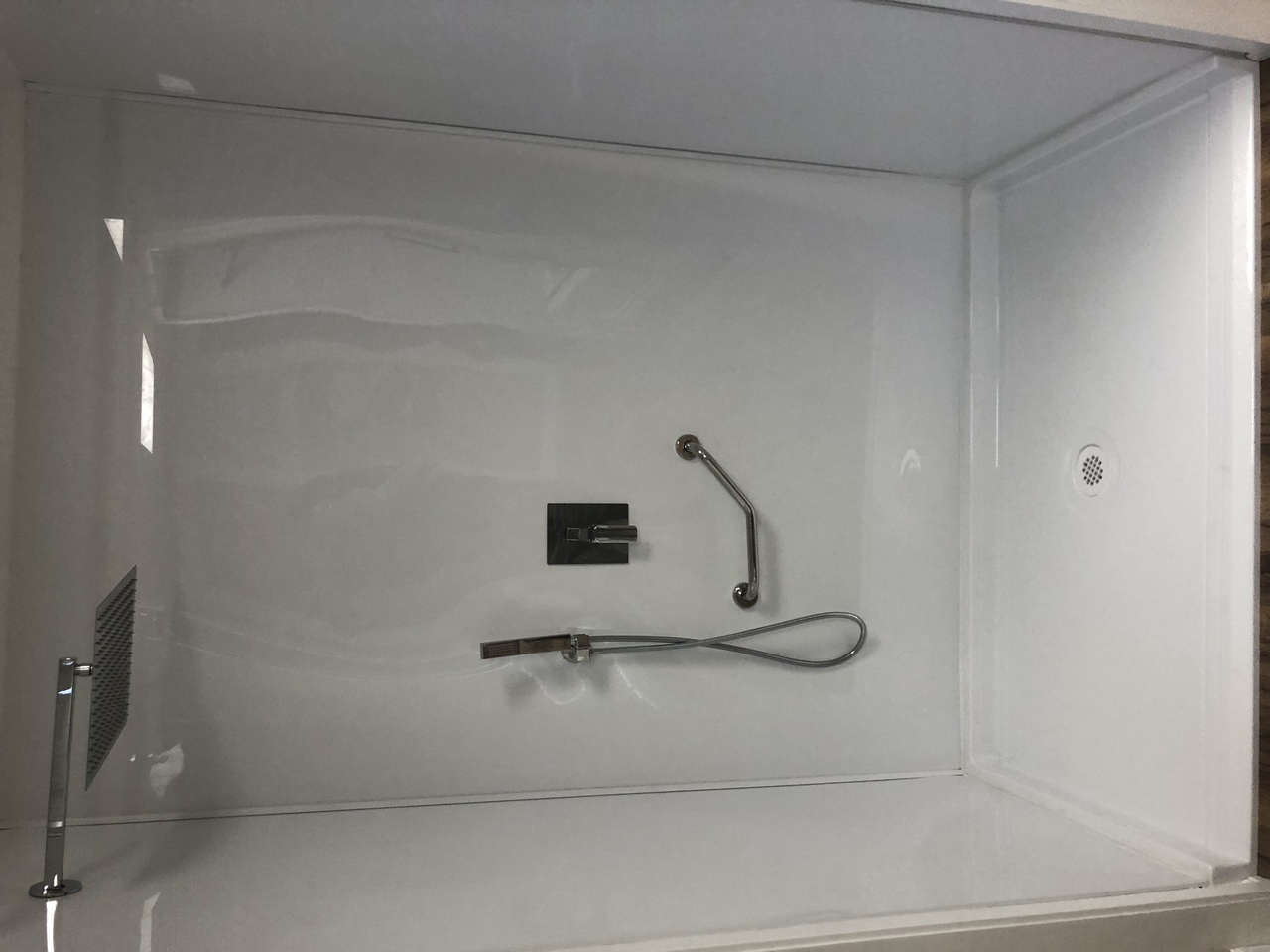 Modern bathroom interior with freestanding bathtub, large windows, green plants, and minimalist vanities. Modern bathroom interior with freestanding bathtub, large windows, green plants, and minimalist vanities.