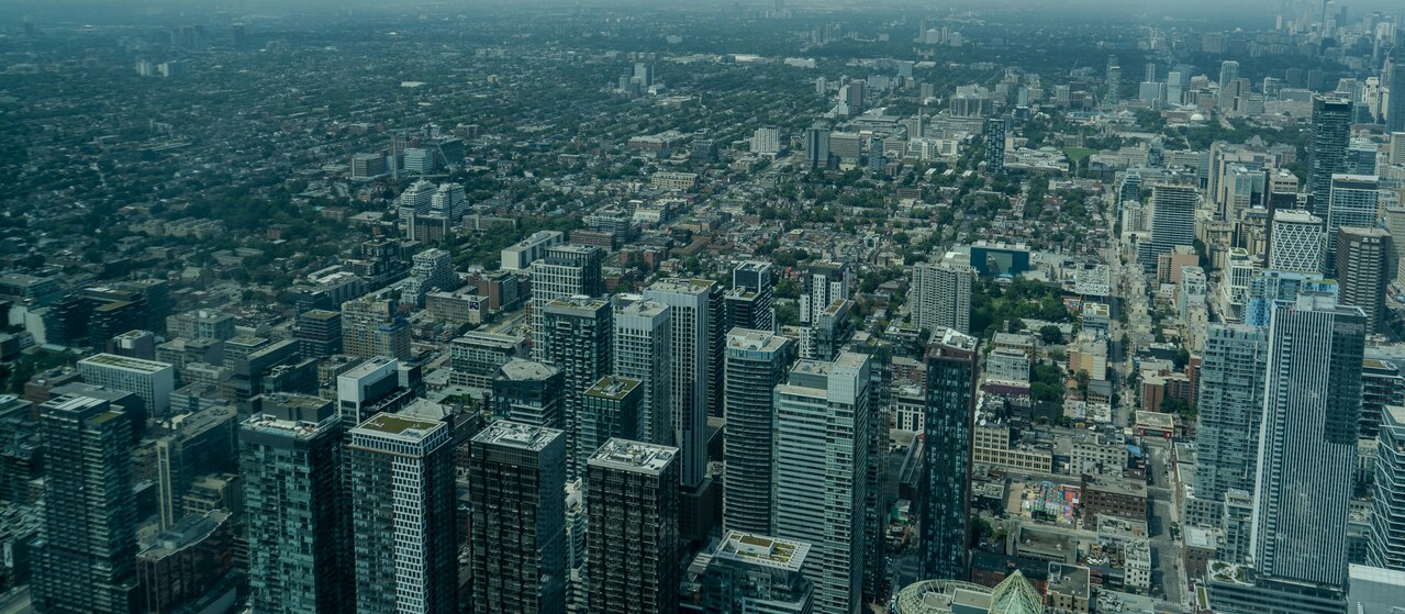 An aerial view of a city with tall buildings