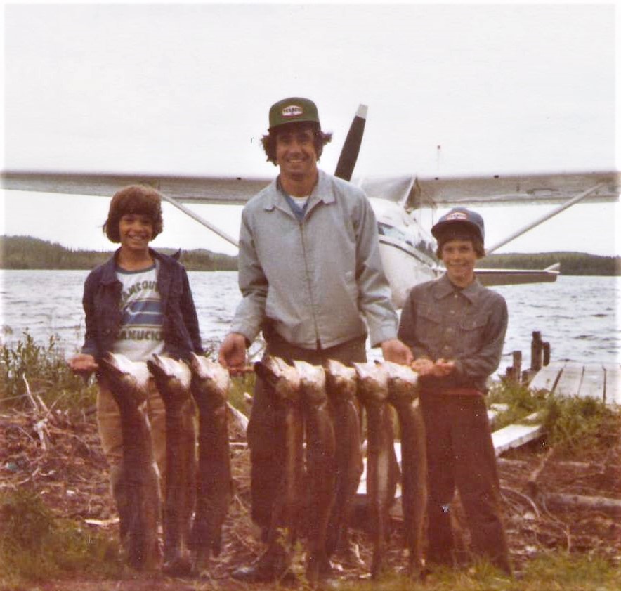Wow what a catch! We aren't sure who they are, or where they went, but they sure were successful! Let us know if you recognize these big smiles!
**Edit**
This is (L-R) Chris, Eugene and Mike Dextrase
2016.33.01 / Siemens, Elizabeth