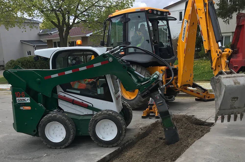 Machinery digging to find and repair a utility line