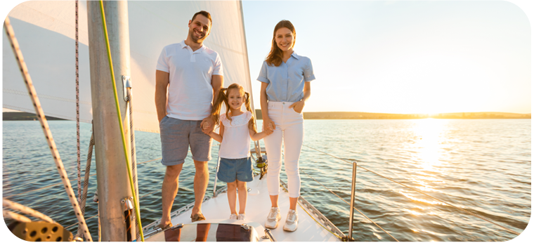 A family standing on a boat smiling A family standing on a boat smiling