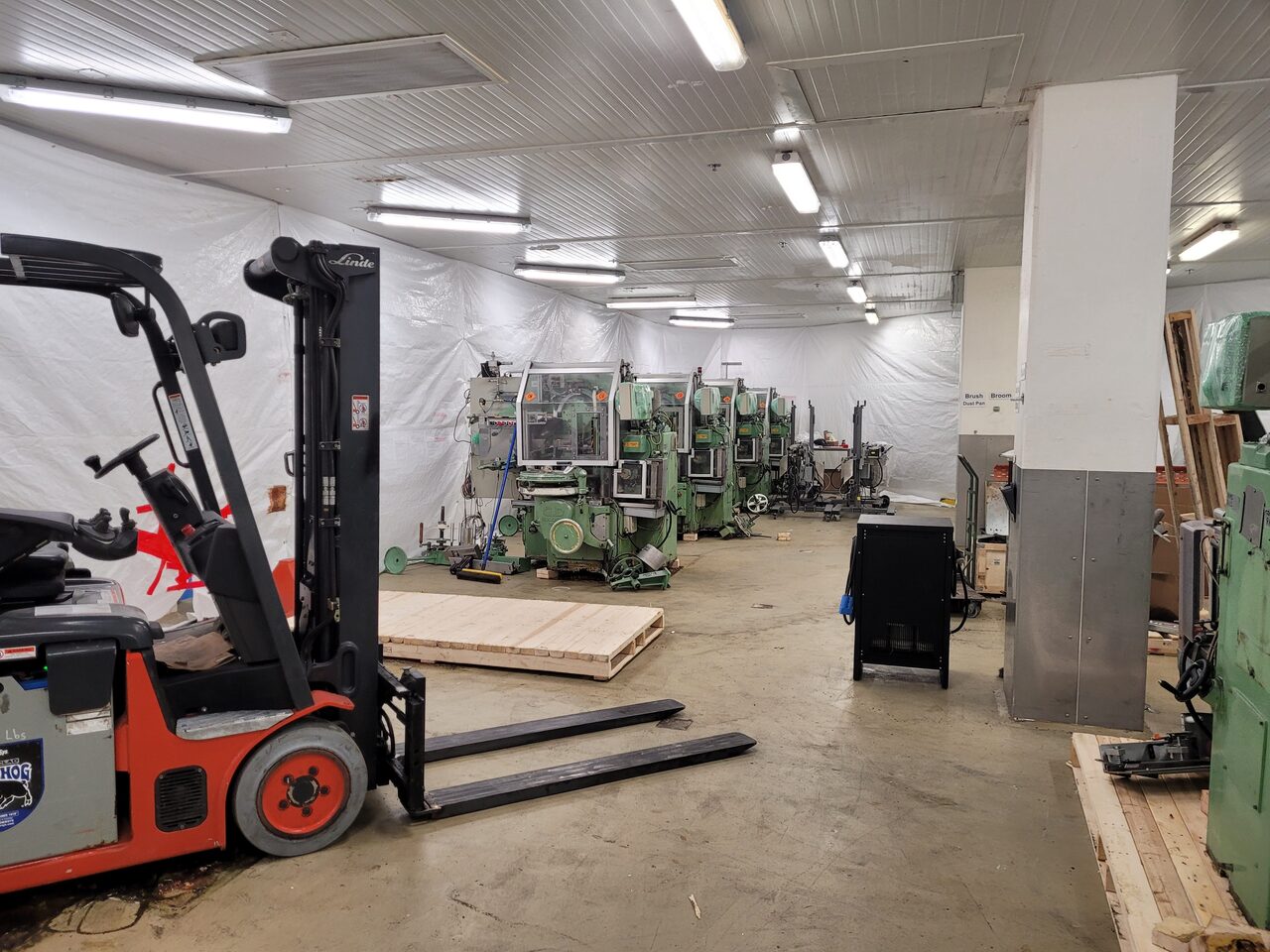 a factory filled with lots of orange machines