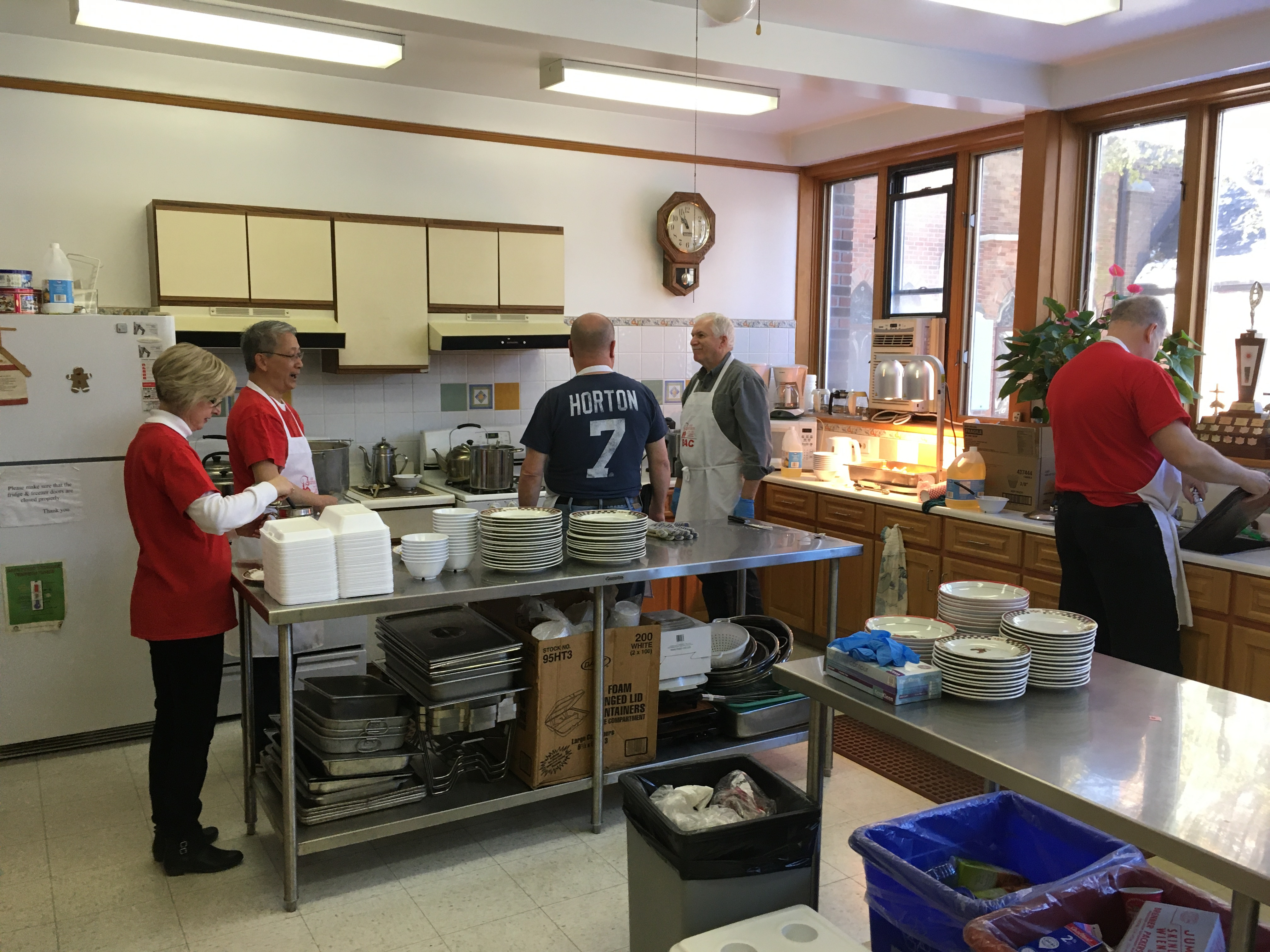 Some of the Brotherhood of Anglican Churchmen and helpers preparing the meat pie and chili dog lunch
