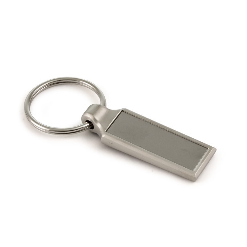 Smiling barista with beard and glasses in cafe, wearing branded apron, holding a glass of beer, text overlay 'Your Brand on Anything'.