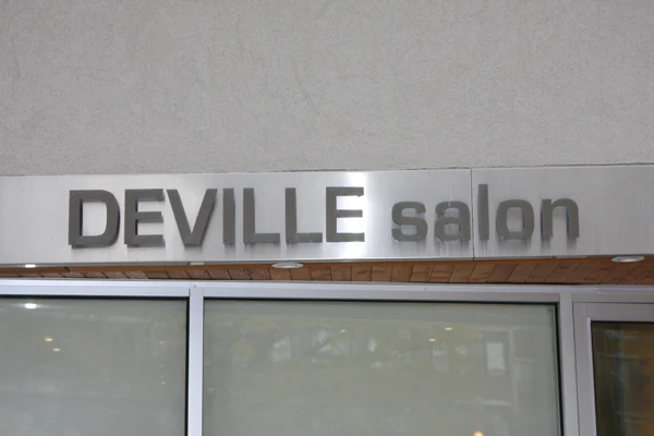 Deville Salon signage
