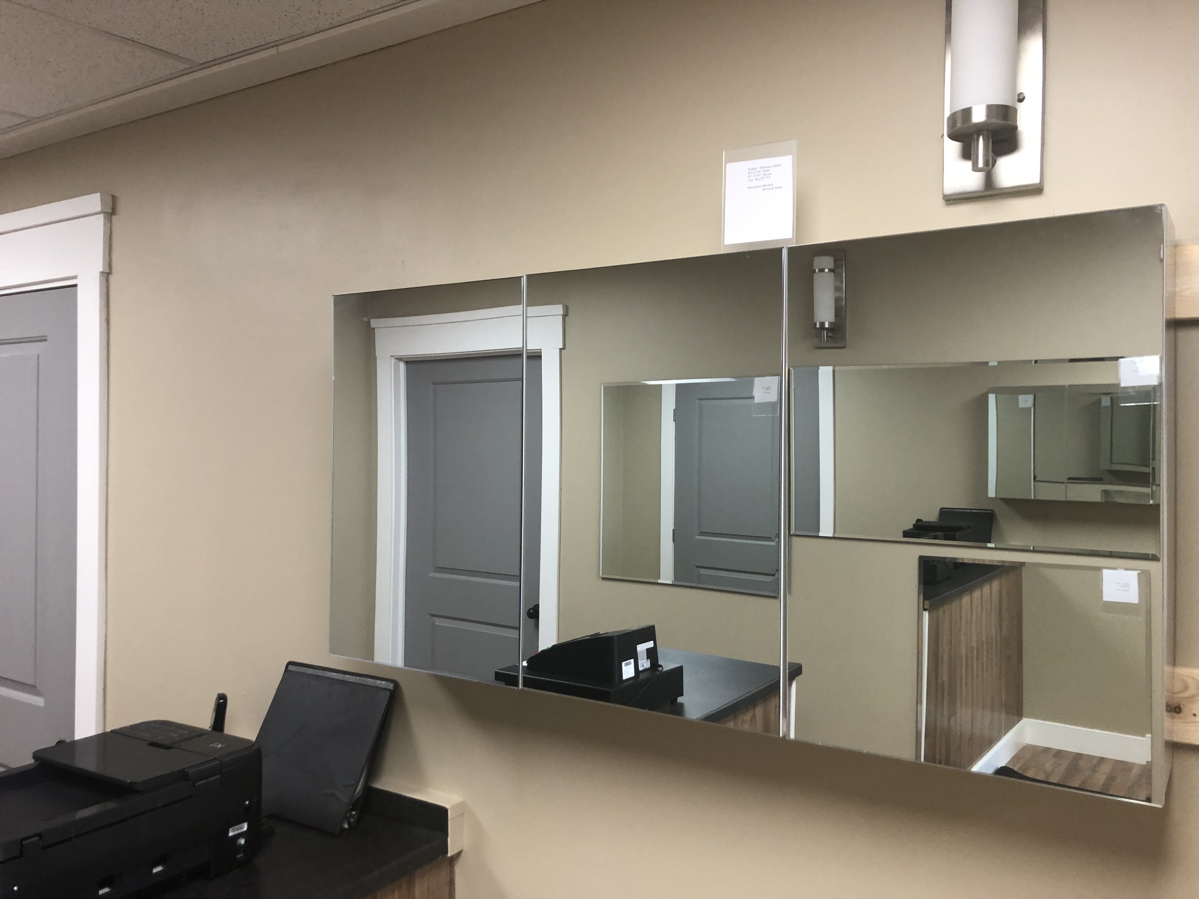 Modern luxury bathroom with freestanding bathtub, large windows, wood accents, and marble tiles.