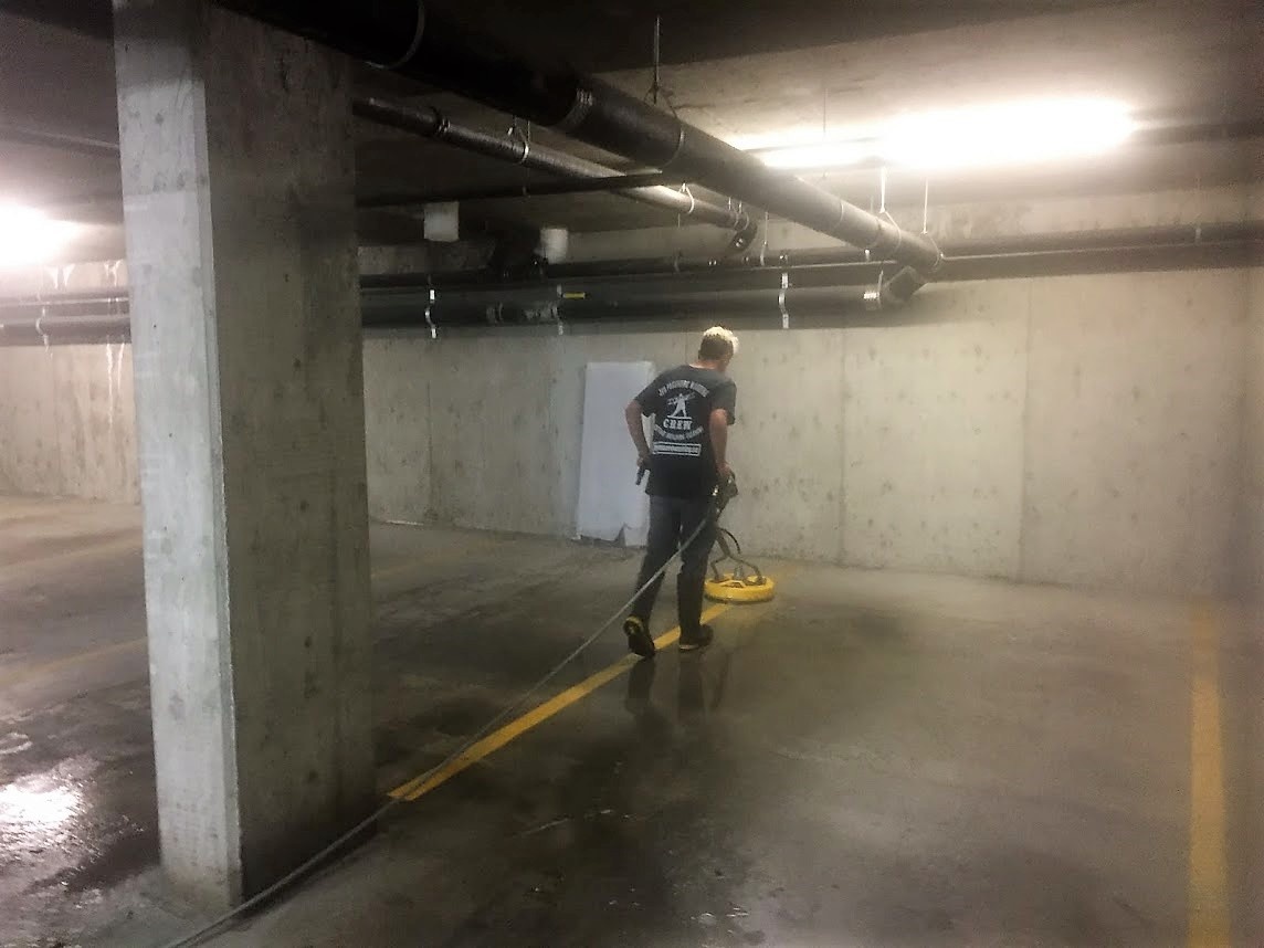 using surface cleaner to clean underground parking garage