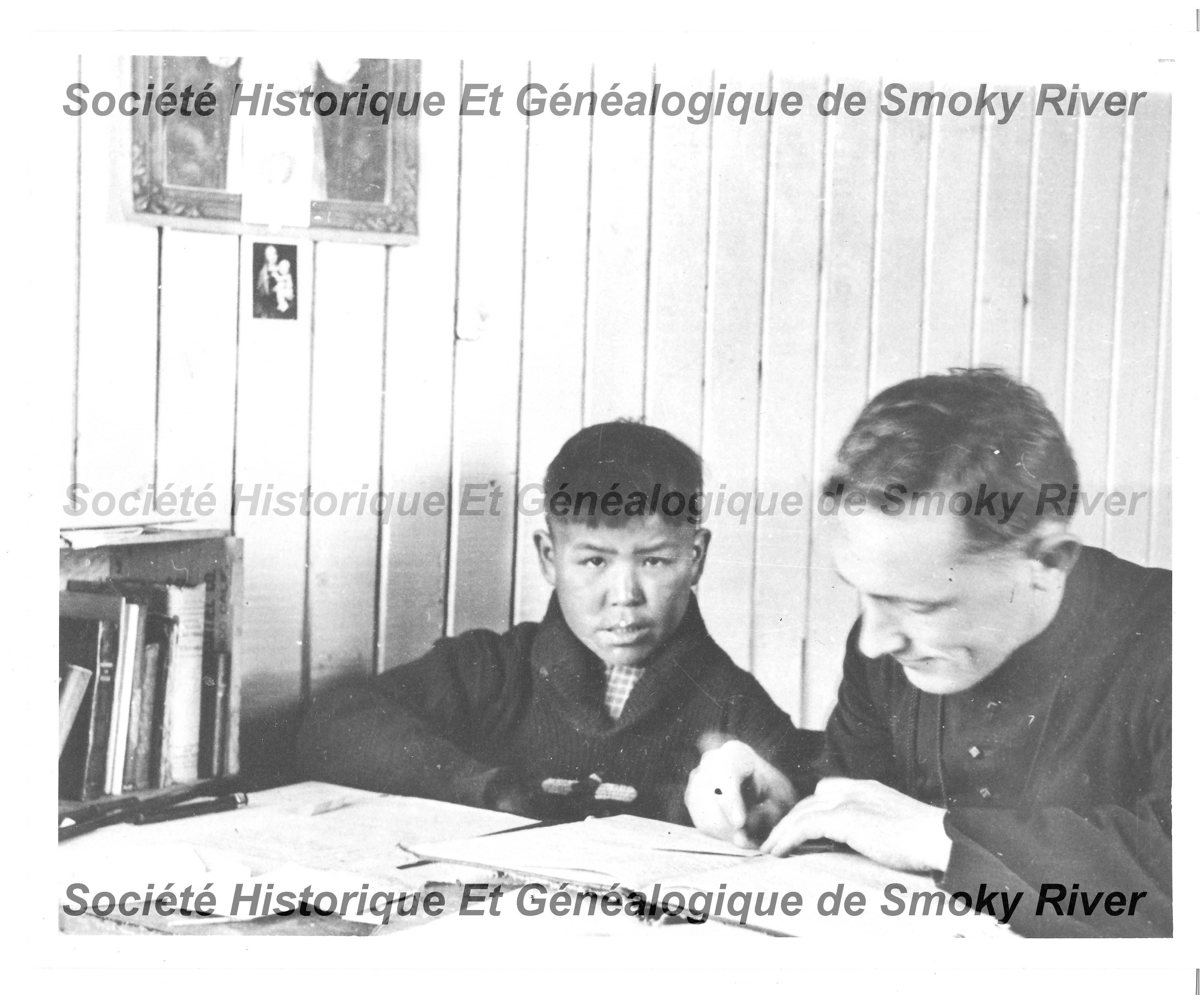 This is a photo of Father Emile Jungbluth o.m.i. and his language teacher. From historical records we know this tutor was teaching him the Beaver language - but we don't know what his name was. Let us know if you recognize him!
2006.01.58 / Societe Historique et Genealogique de Smoky River