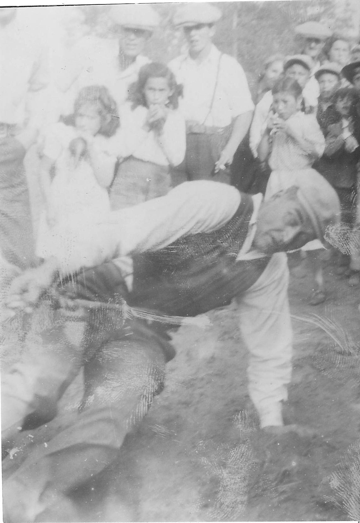 This gentleman is struggling to win the Tug-of-war competition at the "Sports day" competition. Sports day was held every July 1st at the rodeo grounds and was a great time of the community coming together for fun and games! Let us know if you recognize this fellow (or the others in the background).
990.4.3.24 / Bailey, G. Cook
**EDIT**
This is Lawrence Lambert. 