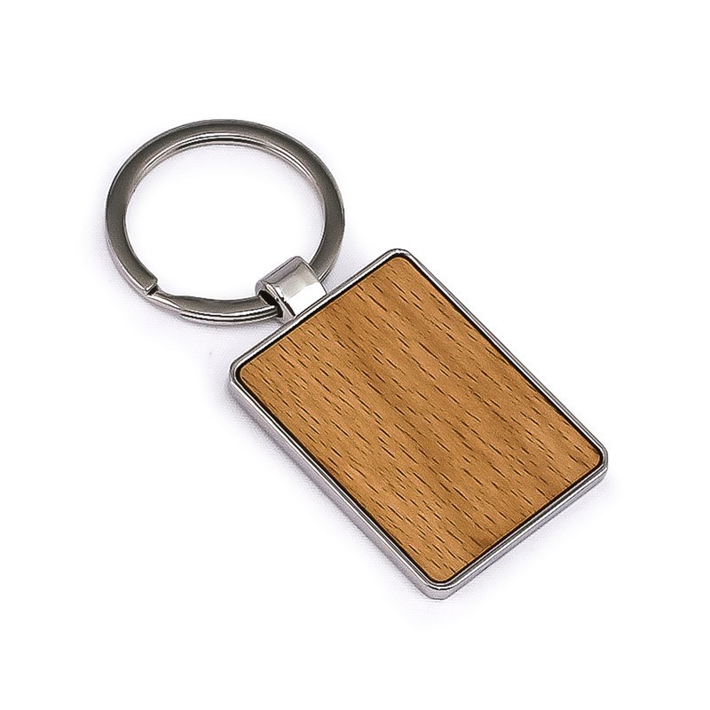 Smiling construction worker in an orange apron and white hard hat standing confidently on a sunny street with blurred people and buildings in the background.